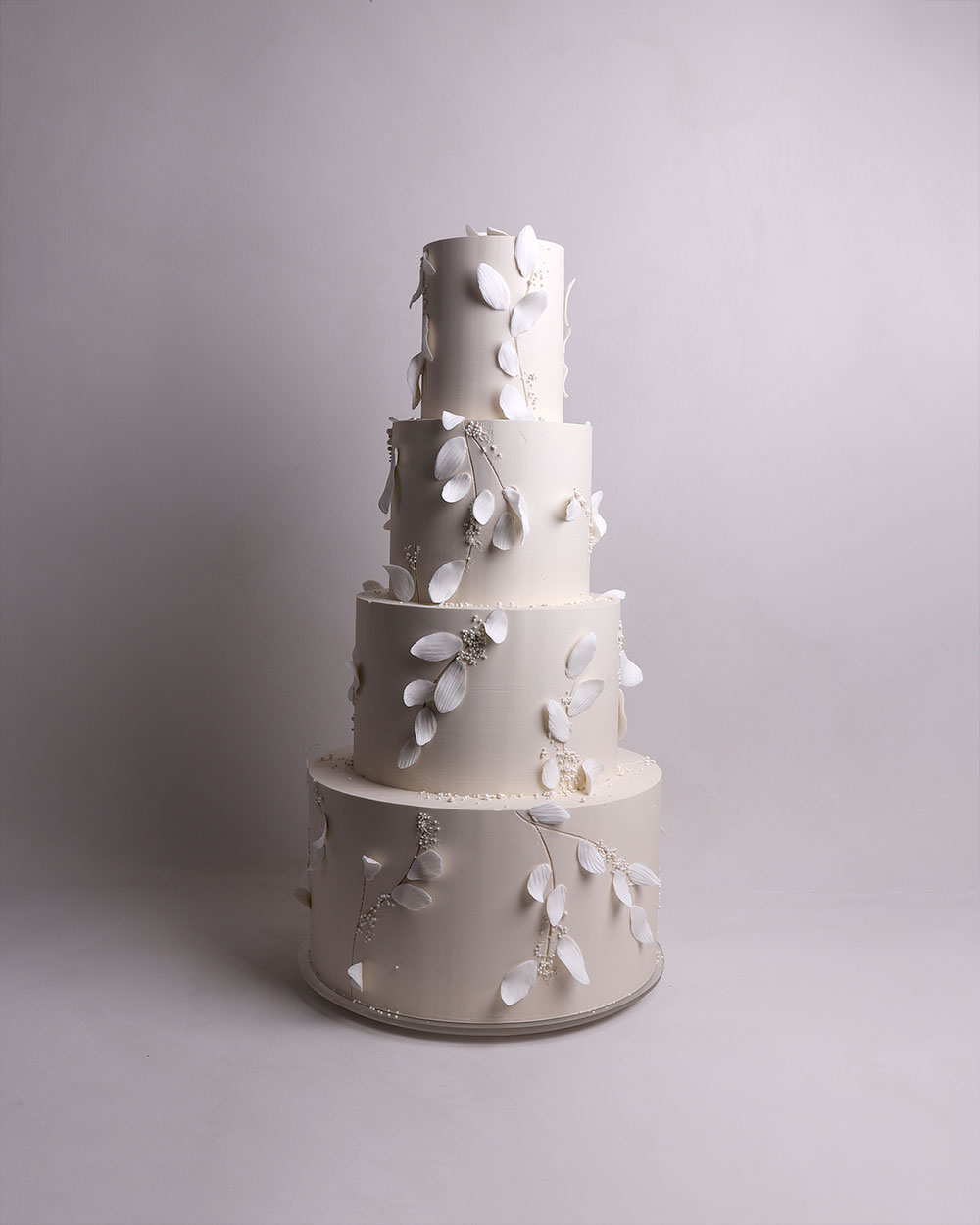3 tier wedding cake with gumpaste ruffles in autumn tones and blush pink