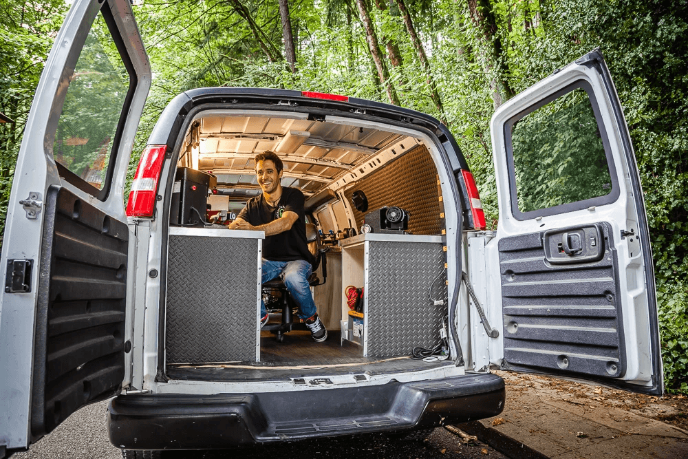 A Locksmith technician in a Van smiling, Suggesting a professional locksmith service in Minnesota