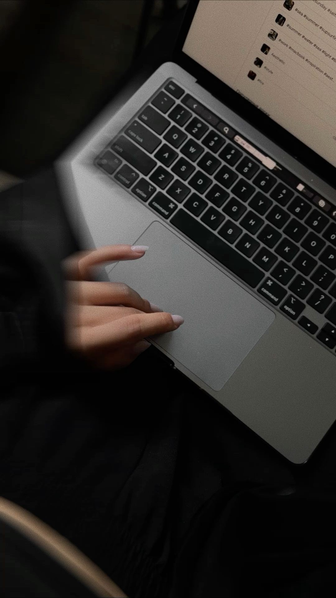 a person sitting in front of a computer screen