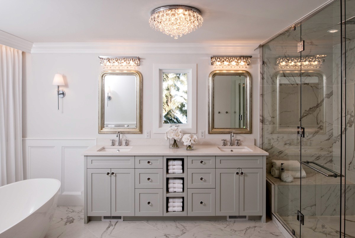 Image of Luxurious primary ensuite bathroom with double vanity, marble floor, and spacious walk-in shower by KHD Homes.
