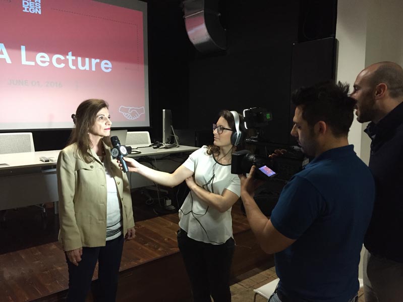 woman making an interview to camera team