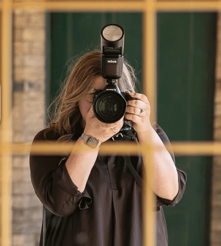 Photographer holding camera