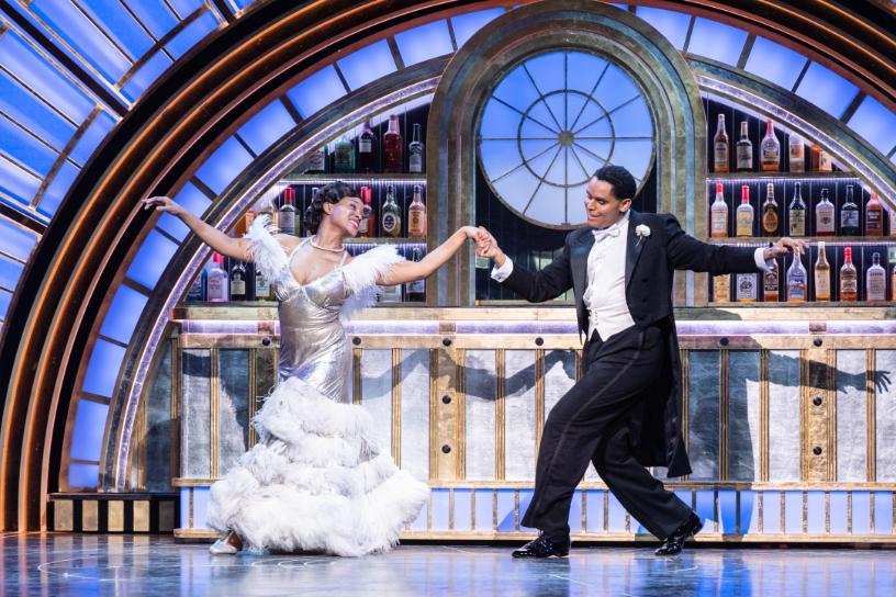 Top Hat dancers performing an elegant duet in a glamorous bar setting.