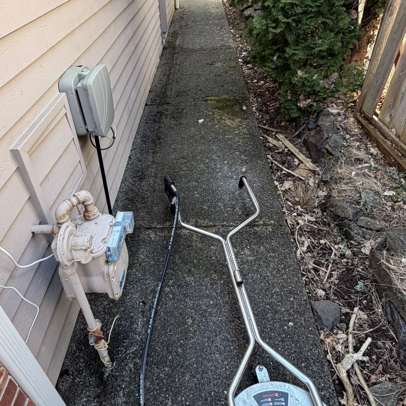 Before: exposed aggregate side path pressure washing in Washington