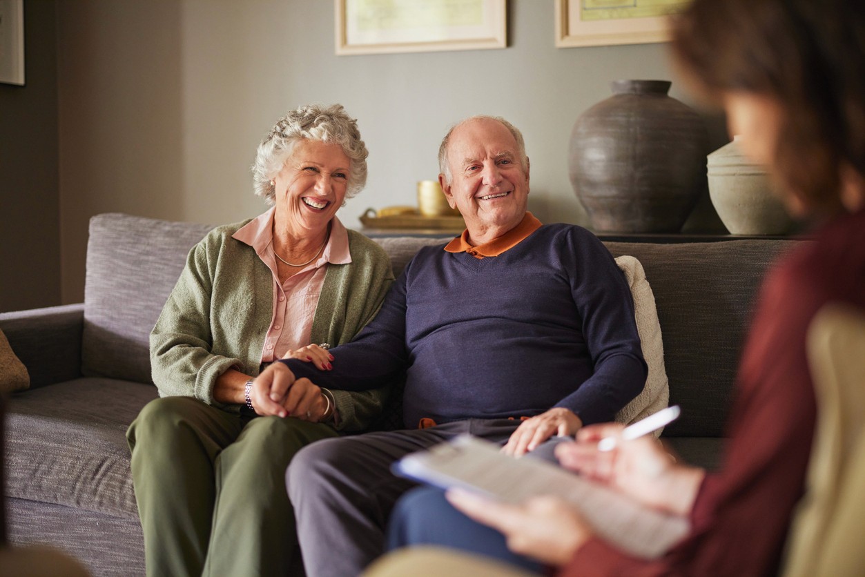Happy senior couple at senior care meeting
