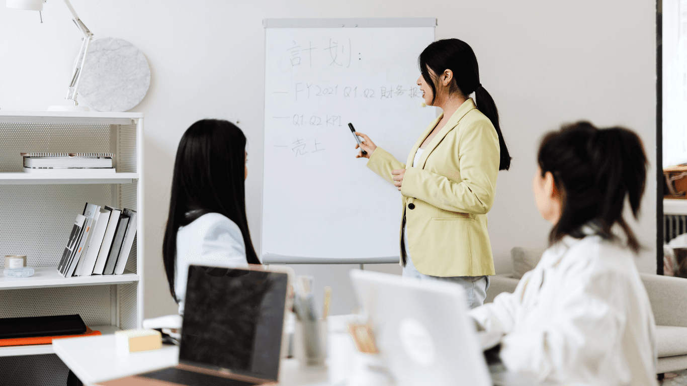 A woman relaxing in soft sunlight, surrounded by plants and warm decor, emphasizing the peaceful and rejuvenating experience of the spa.