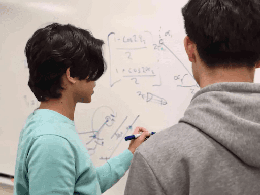 A toothbrush with a soft bristle head positioned against a black background.