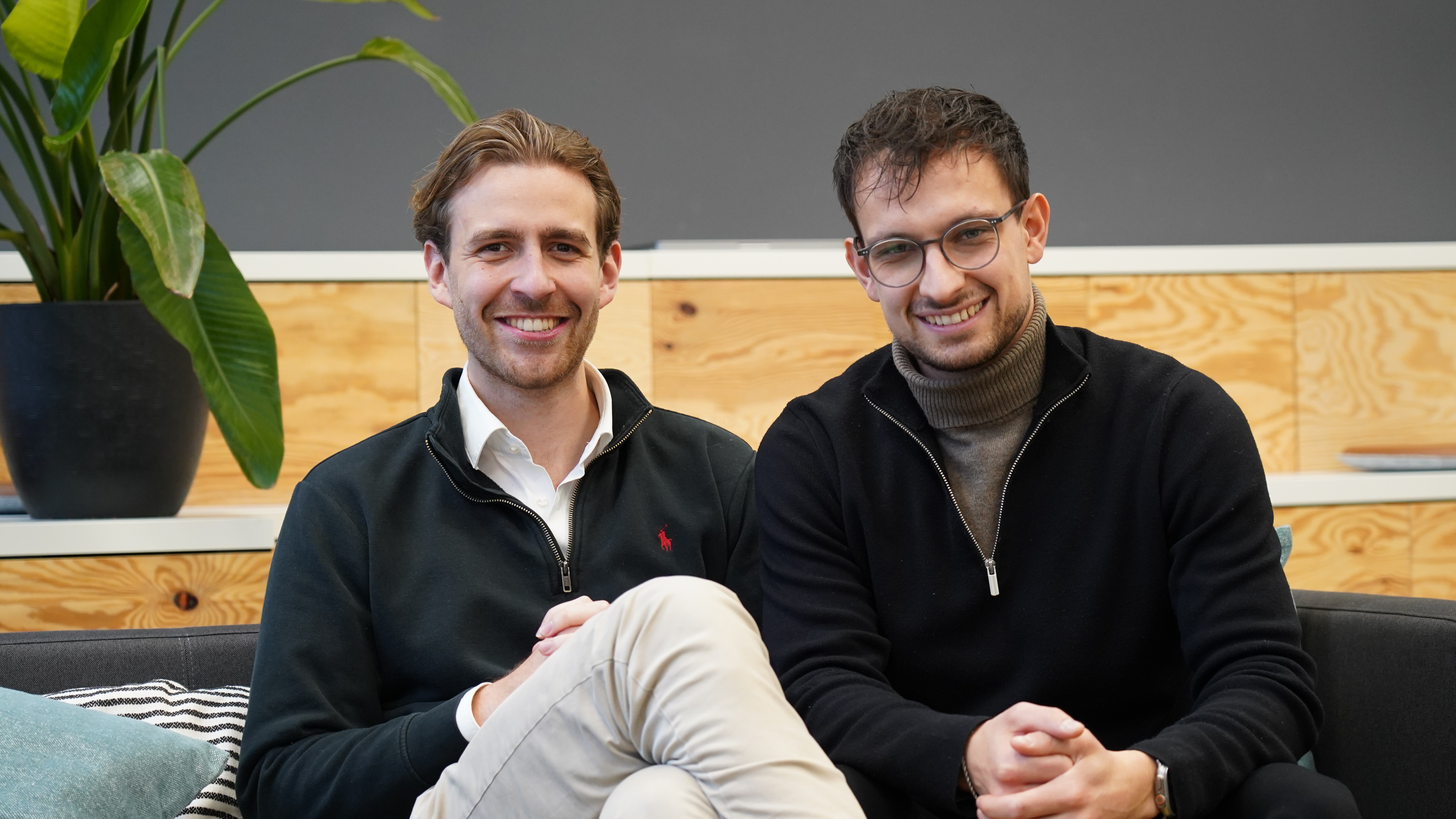 person sitting in a chair in front of a man