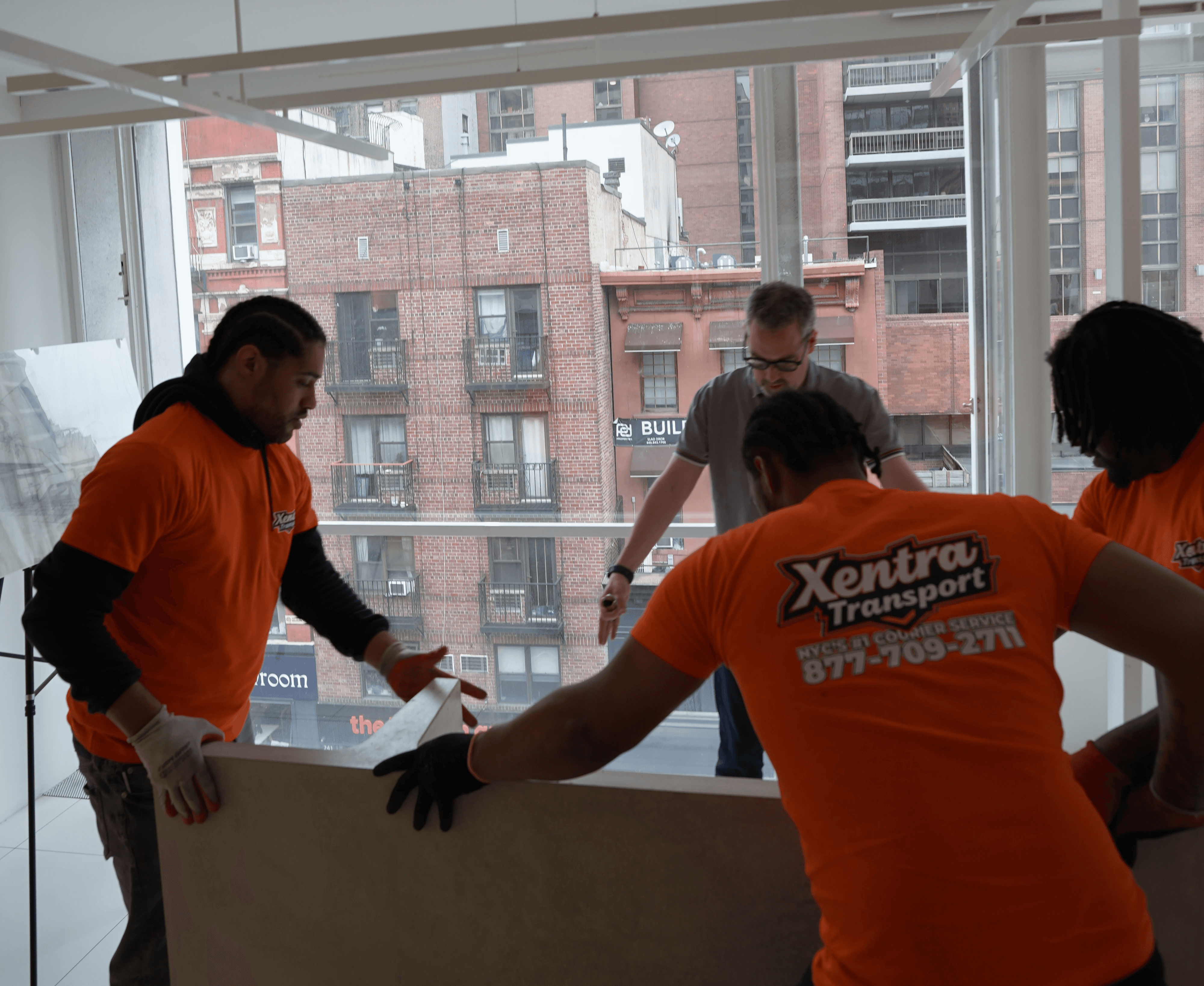 xentra transport crew does a white glove delivery in manhattan for a art gallery