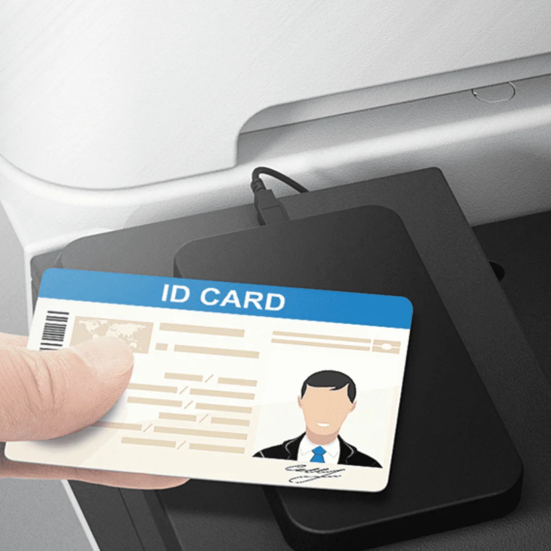 Employee presenting an ID card to a printer card reader