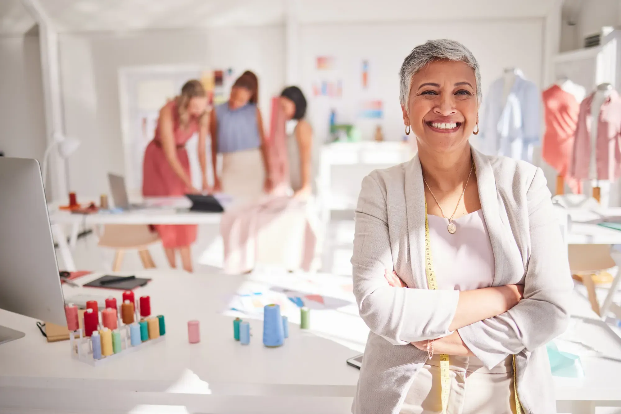 woman smiling in sewing place