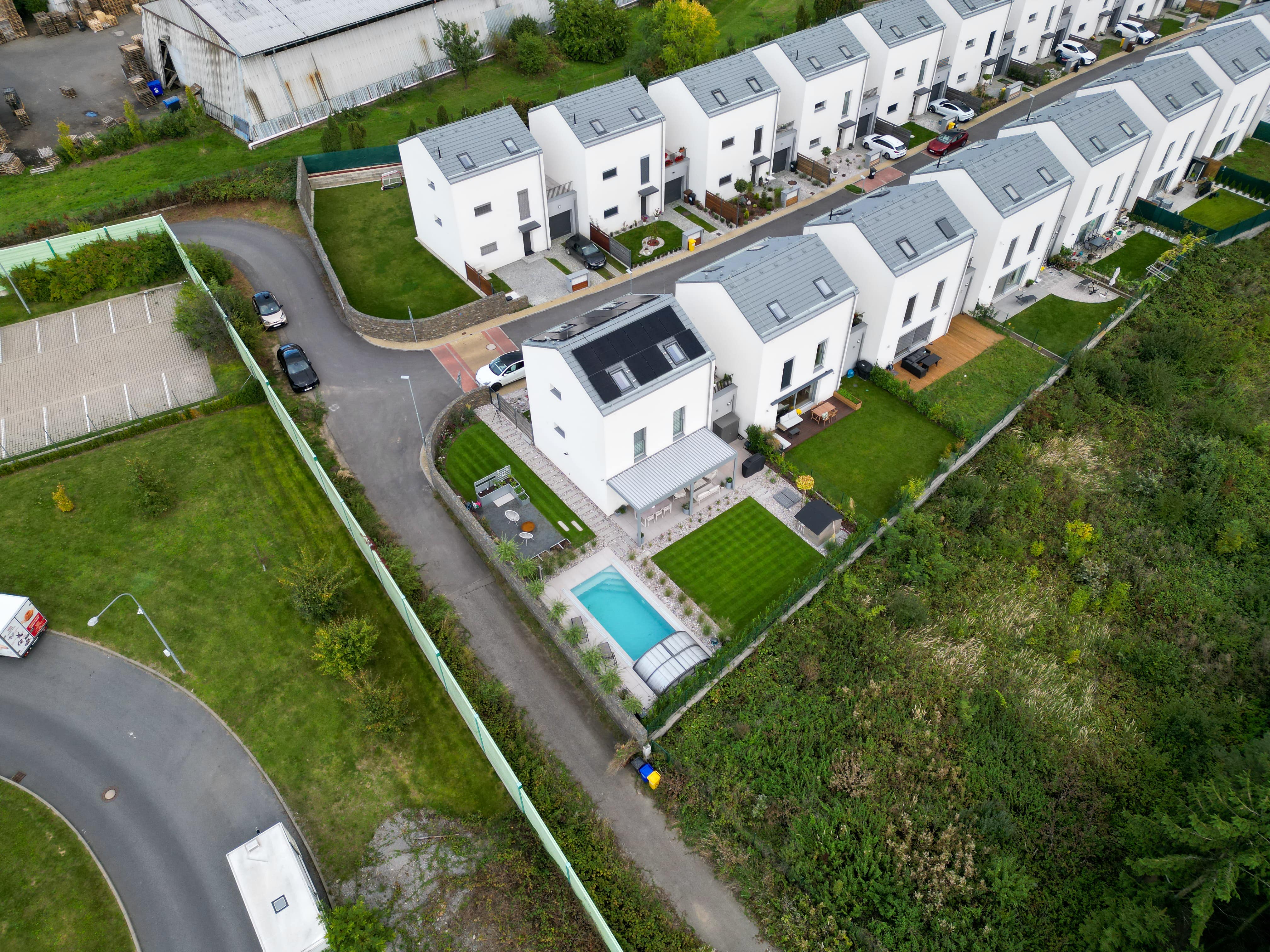 white concrete residential building near trees