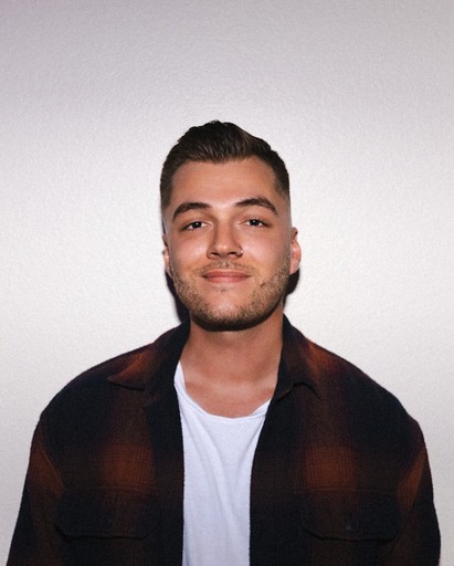 woman holding heft long blonde hair