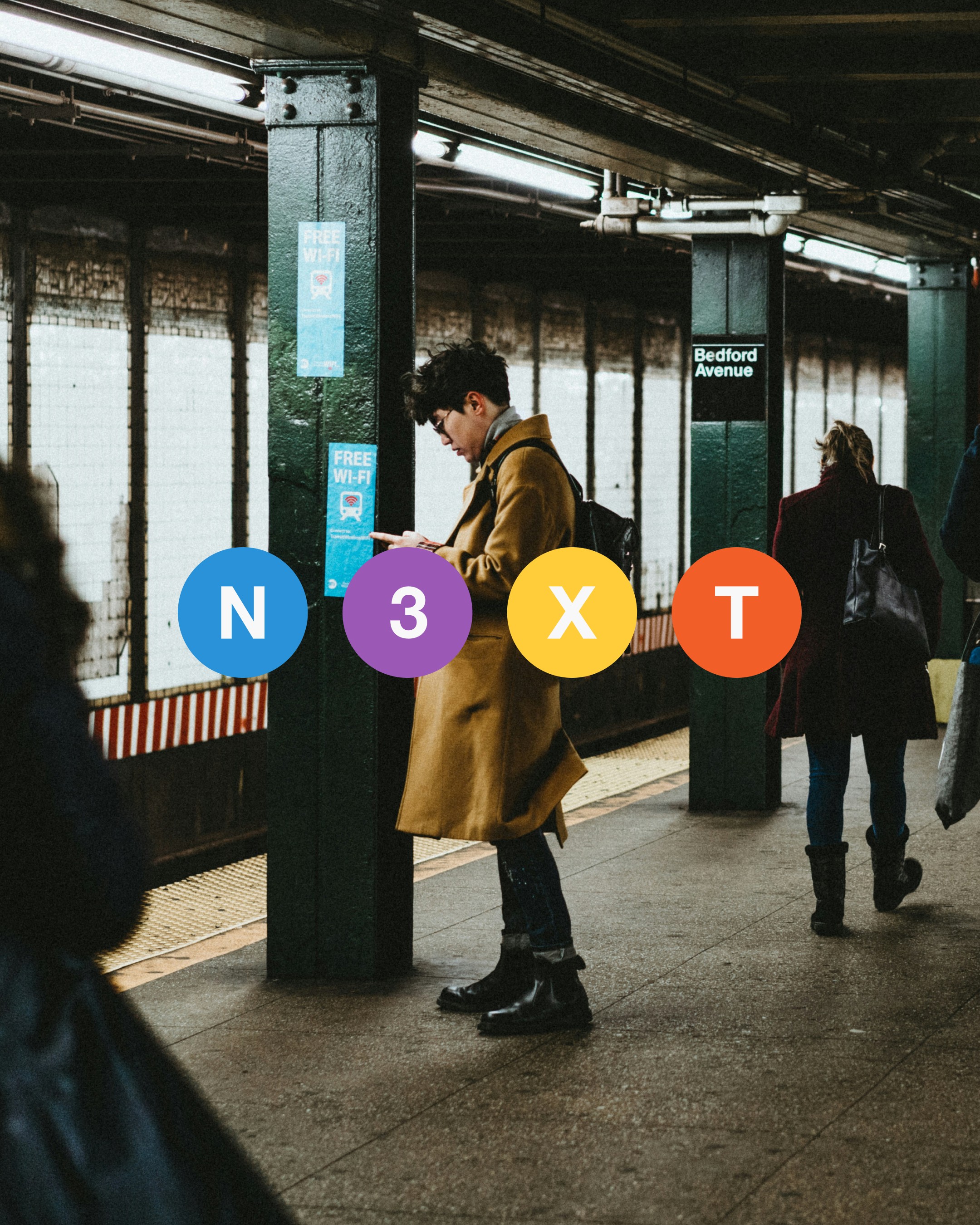 This image depicts a busy subway station platform, likely in New York City, with green pillars, tiled walls, and a 'Bedford Avenue' sign. A person in a tan coat stands near a pillar, while others walk in the background. The design is enhanced with colorful circular icons (blue N, purple 3, yellow X, orange T) overlaid in the foreground, adding a modern, vibrant touch. Perfect for searches like 'subway station design,' 'urban UI inspiration,' or 'New York transit graphic art.'