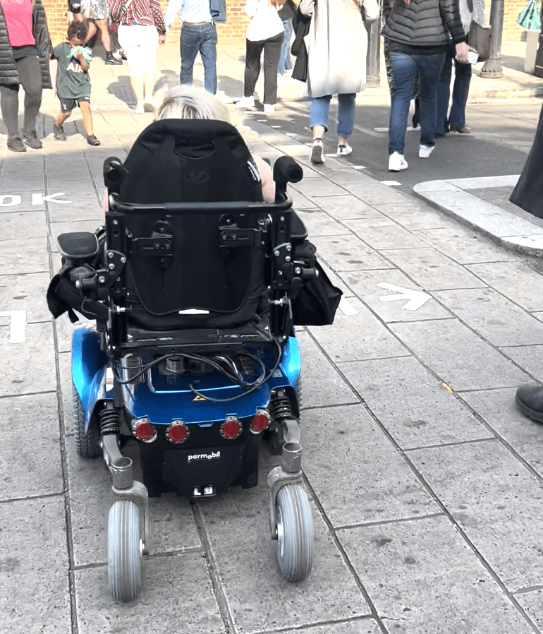 Behind gem's wheelchair