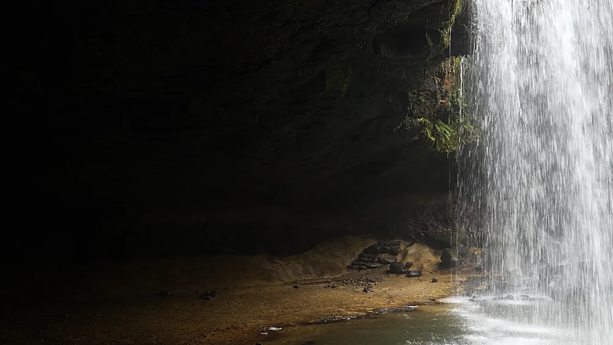 Nabegataki falls seen from the cave behind the curtain of water, near Kurokawa Onsen