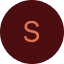 Cercle rouge foncé avec la lettre S en couleur saumon au centre, souvent utilisé comme avatar.