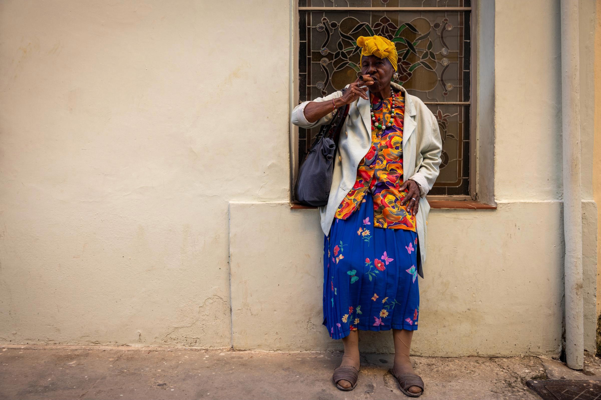 Cuban Charms - A local enjoys her cigar in Old Havana.