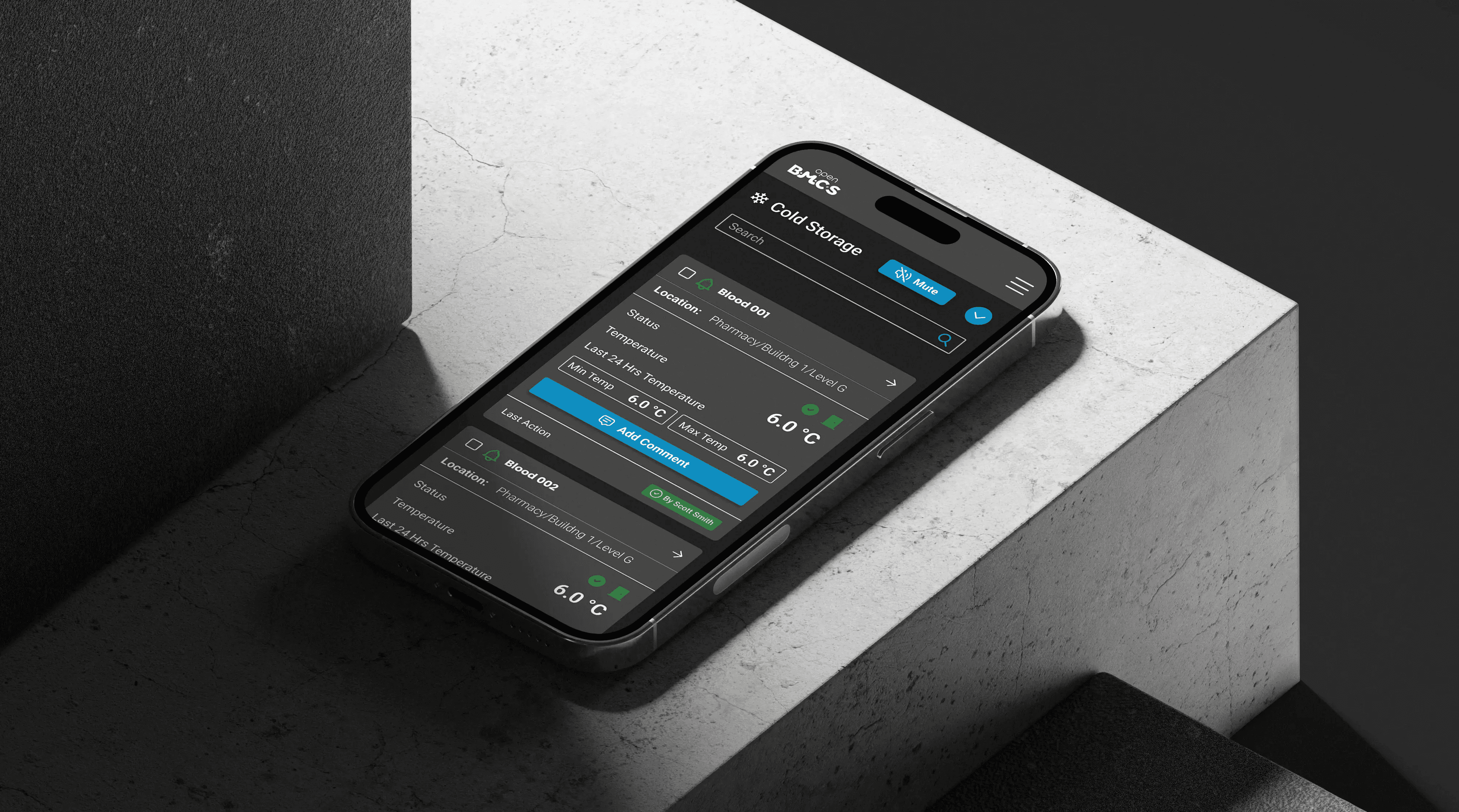 Mobile phone displaying the OpenCCMS dashboard, showing real-time cold chain monitoring data and system status.