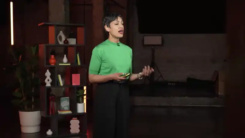 Live camera shot capturing a presenter delivering a talk on stage during the Wired x Kyndryl broadcast.