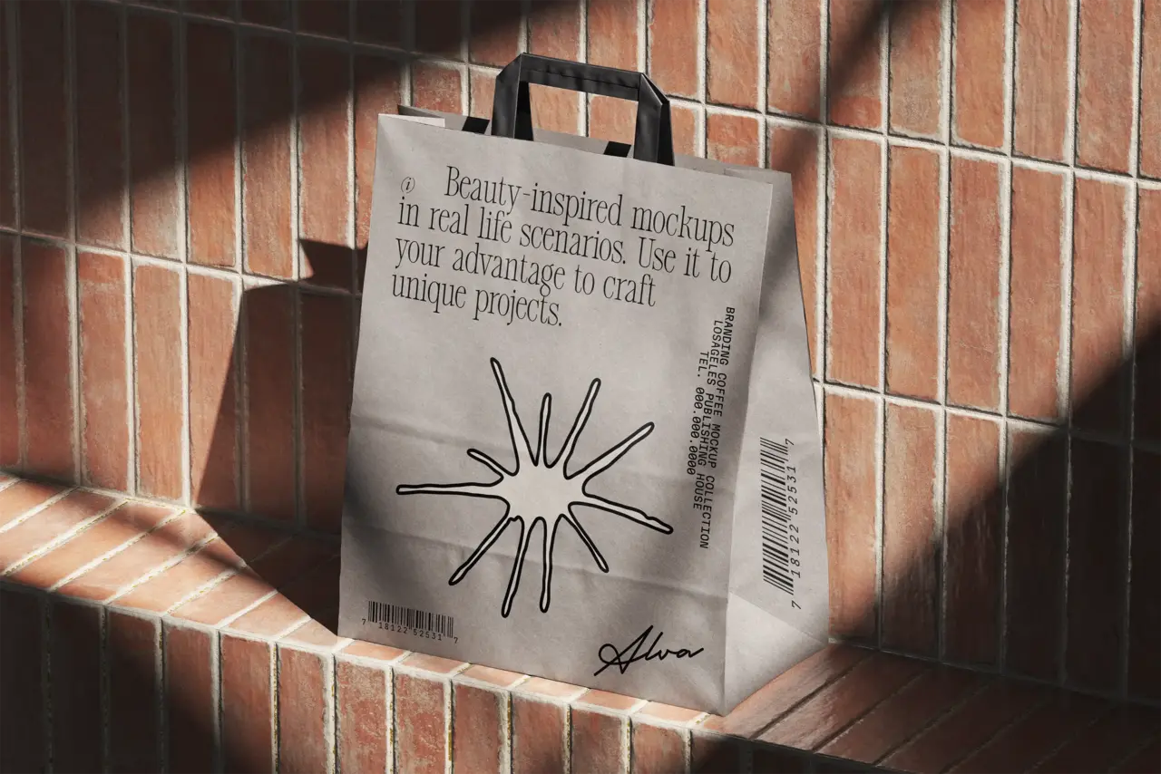 Beige shopping bag with black handles against a terracotta tiled wall.