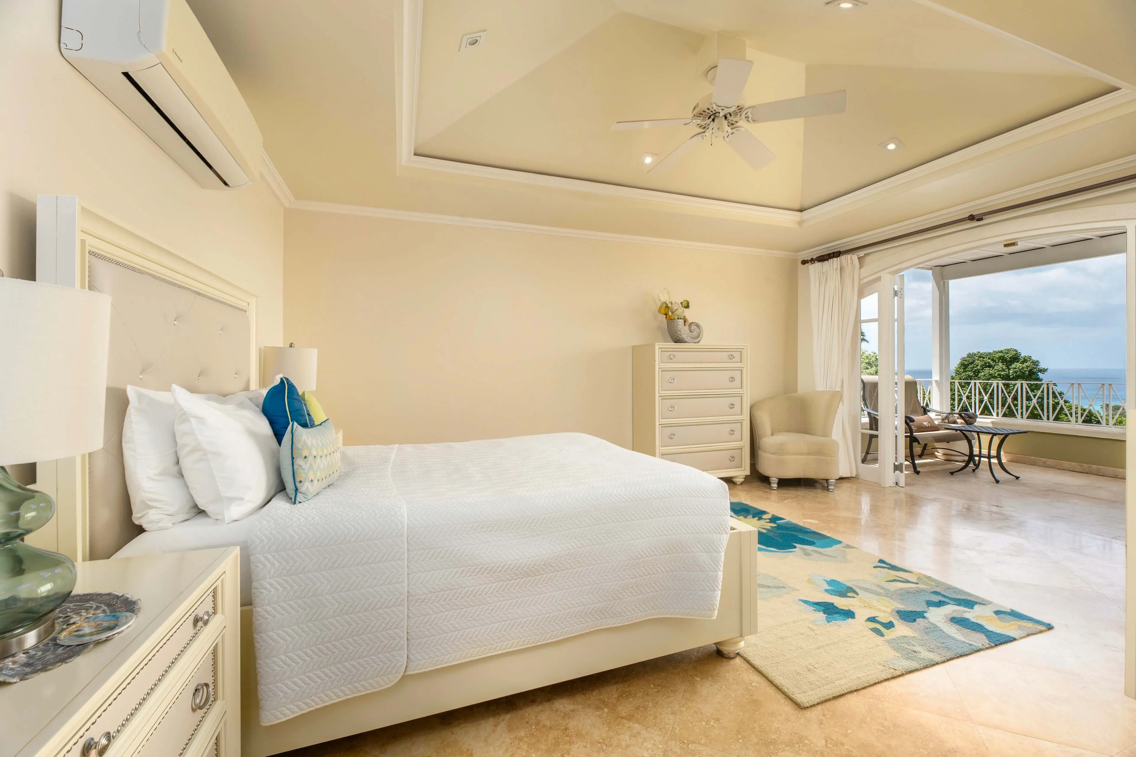 Bedroom with vaulted ceilings and natural light