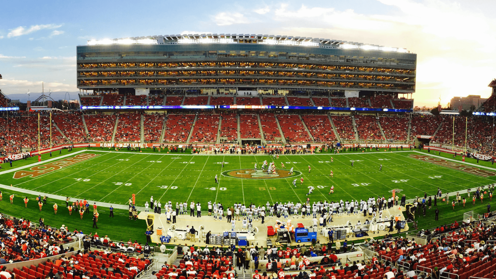 A large football stadium filled with fans, representing stadiums where AI manages energy demand, efficiency, and sustainability at scale