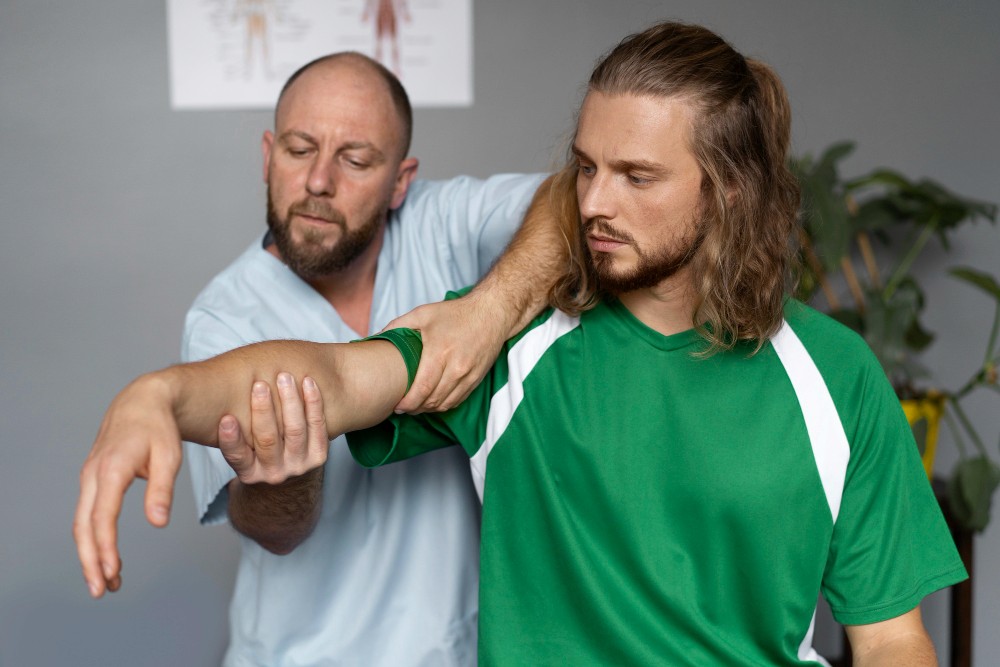 A client who experienced muscle strain receiving physiotherapy.