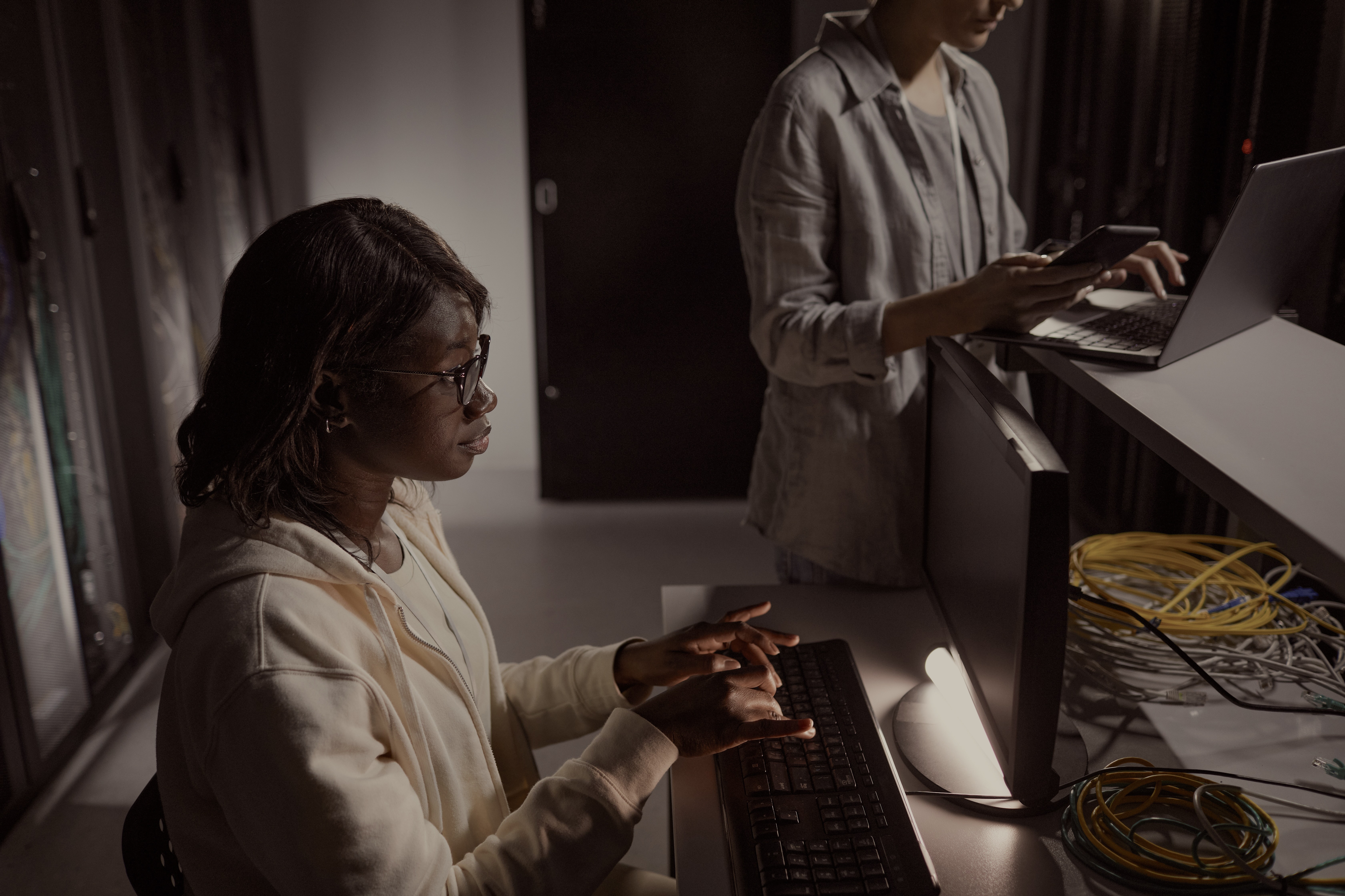 Woman in a server room working