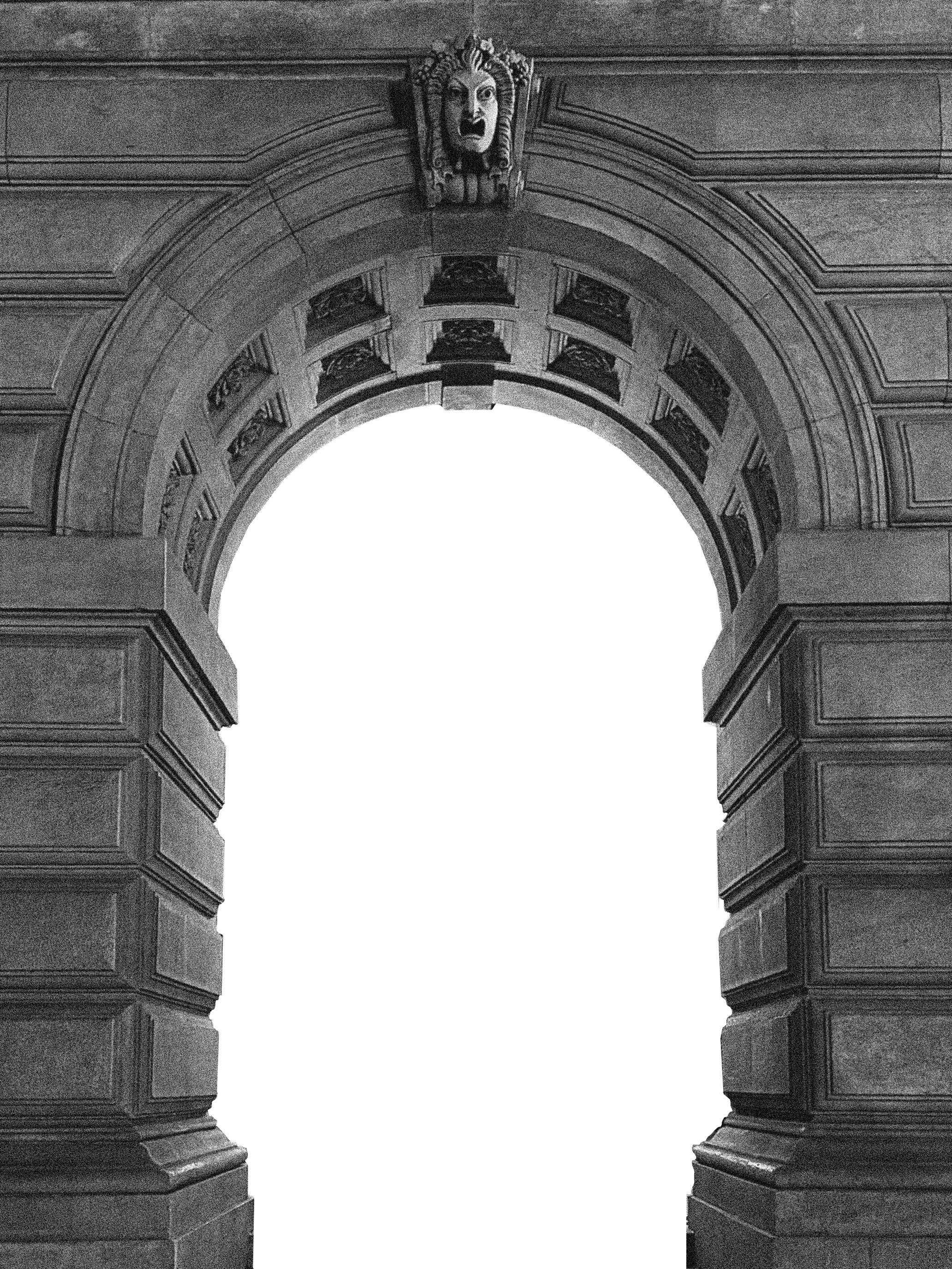 A modern gallery space with a geometric abstract painting on a white wall