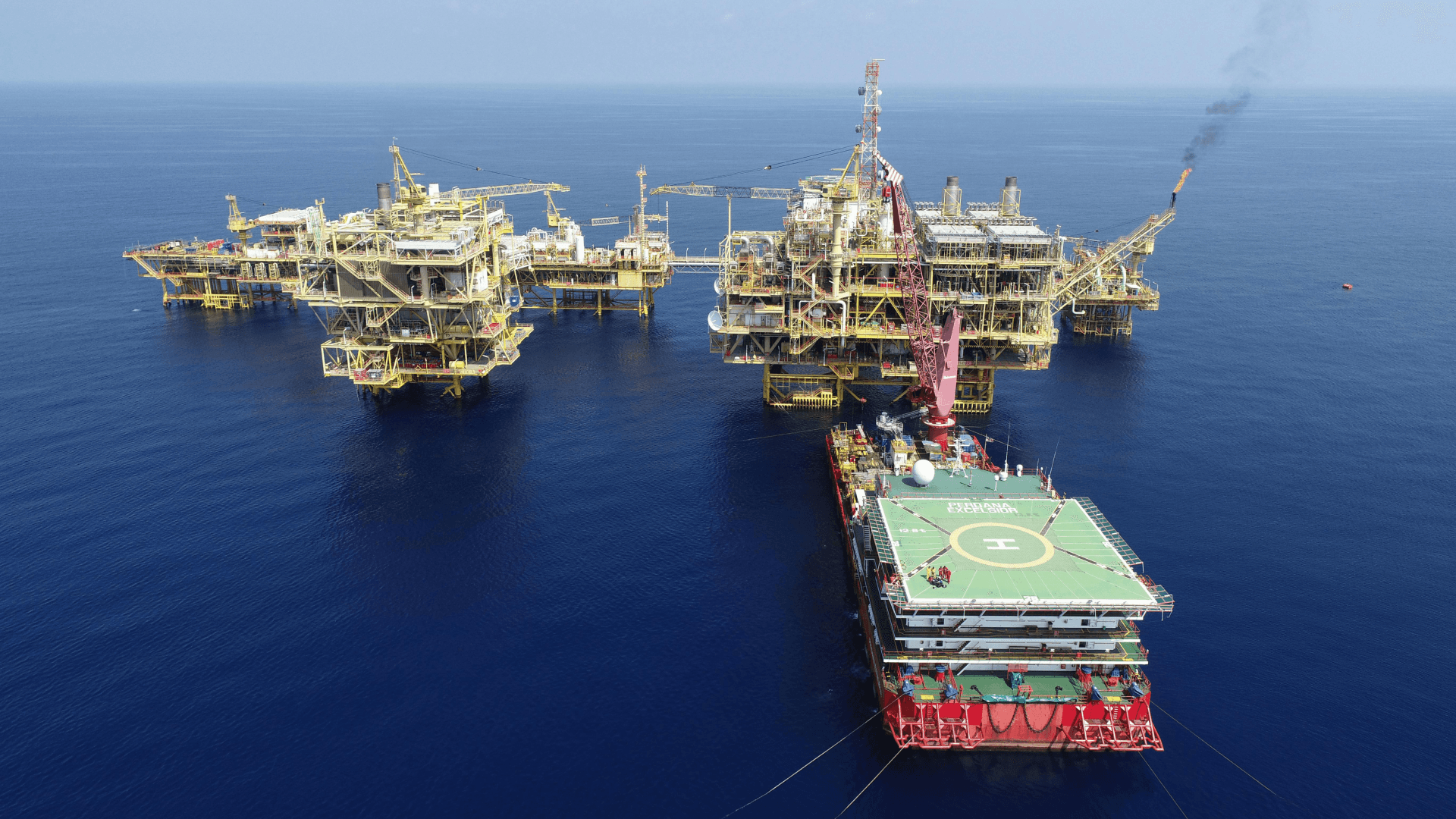 Offshore oil and gas platforms, representing the complexity of modern energy systems and the opportunity for AI-driven intelligence to enhance efficiency and sustainability