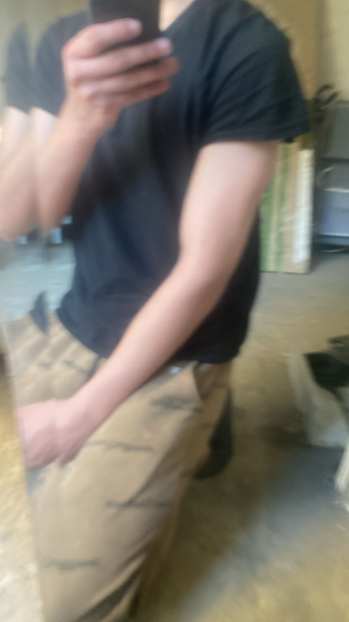 greyscale photo of woman in bralette inside room