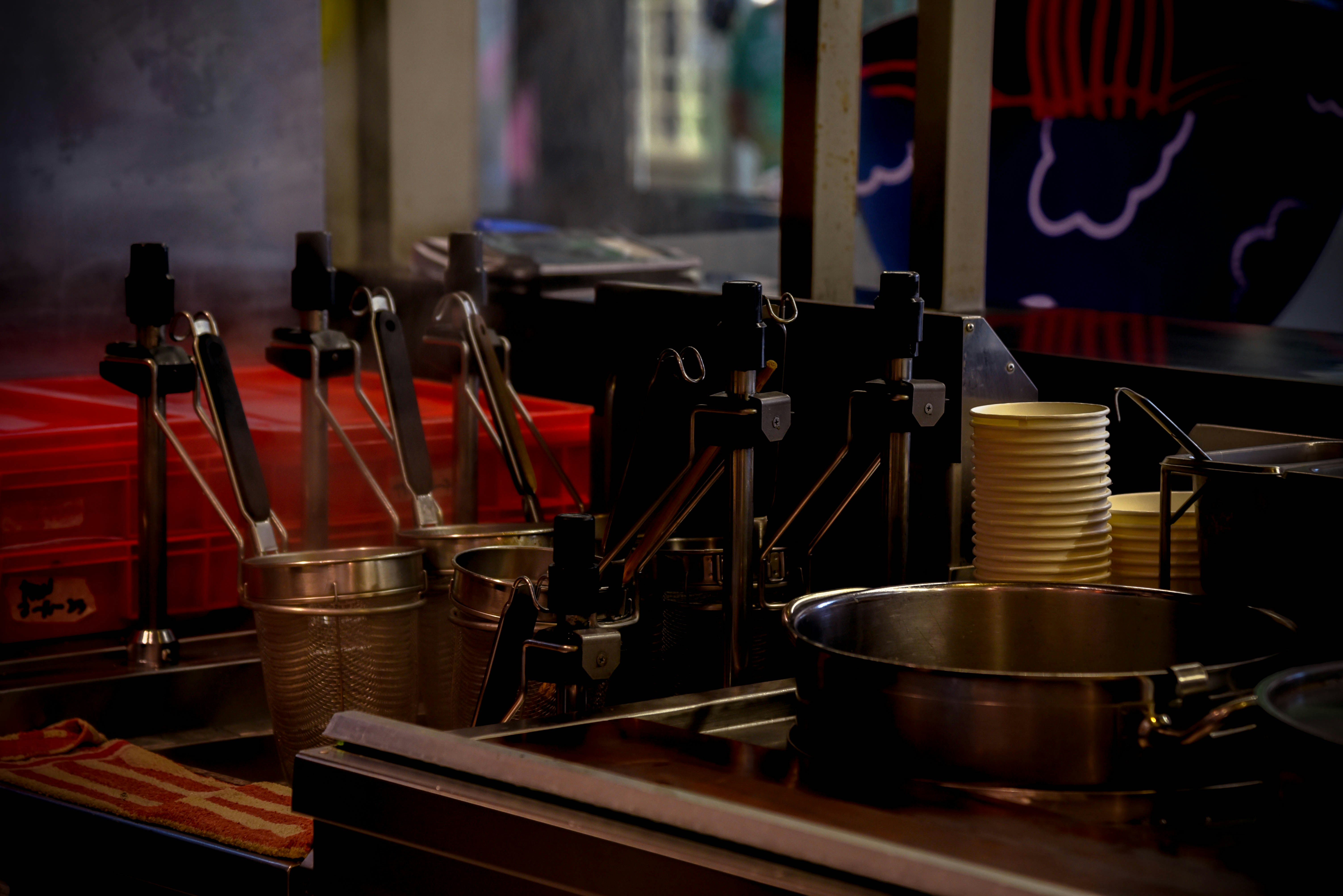 a row of cooking utensils sitting on top of a counter