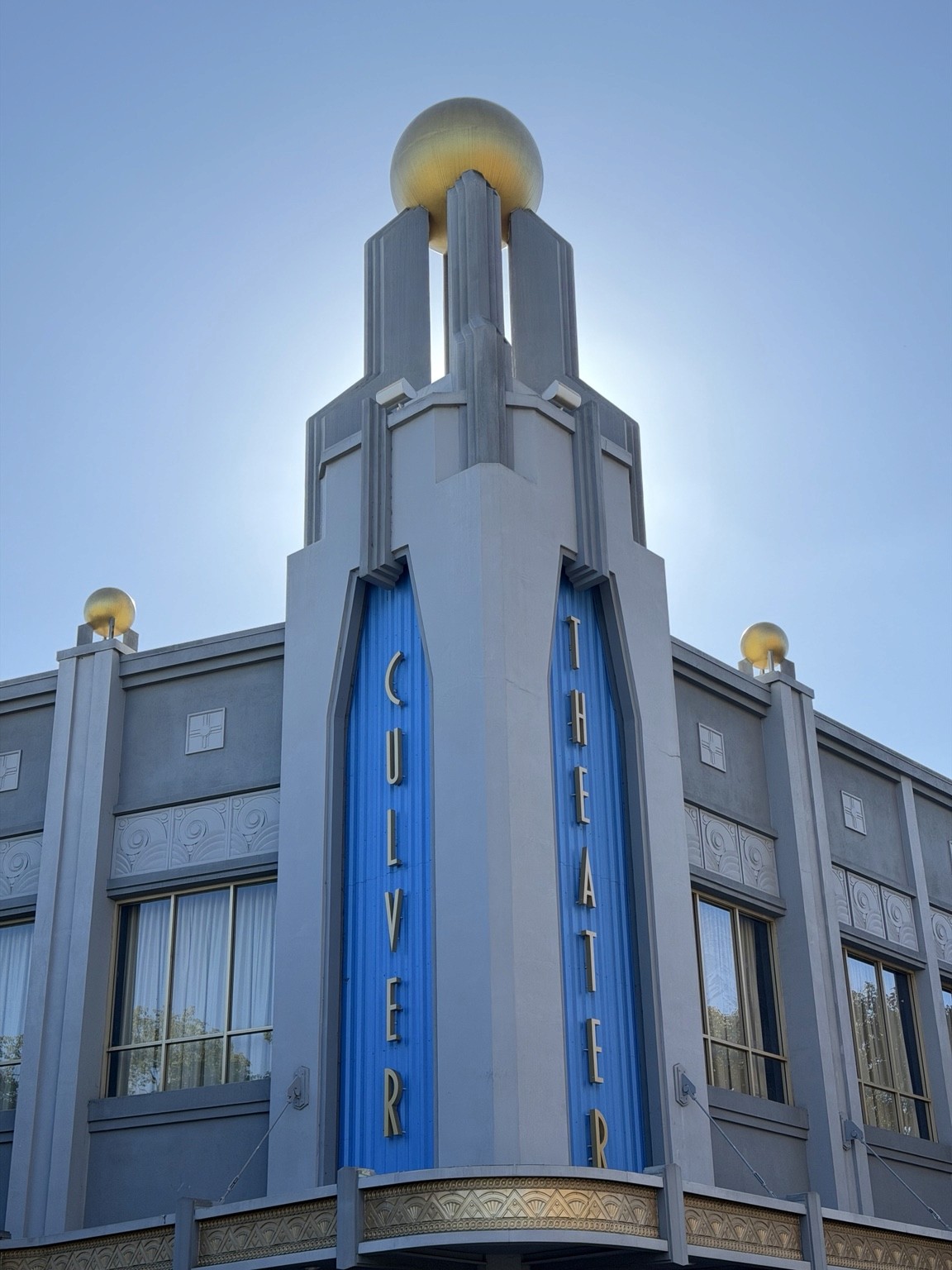Culver Theater with blue vertical lettering and gold globes.