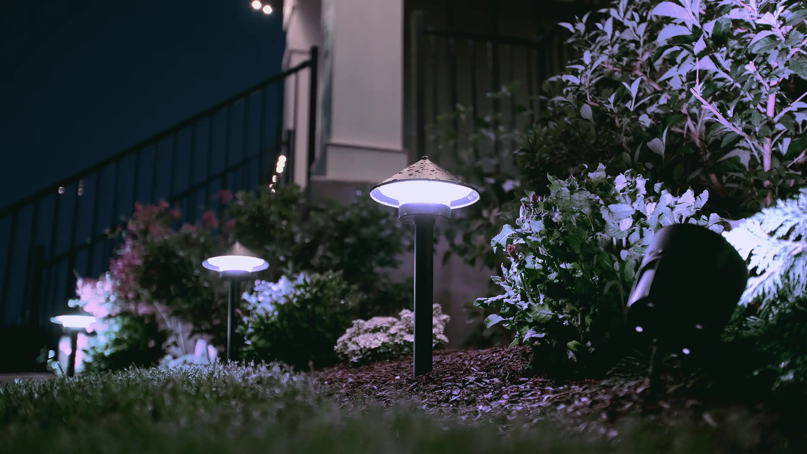 Home with dramatic LED roofline lighting at night