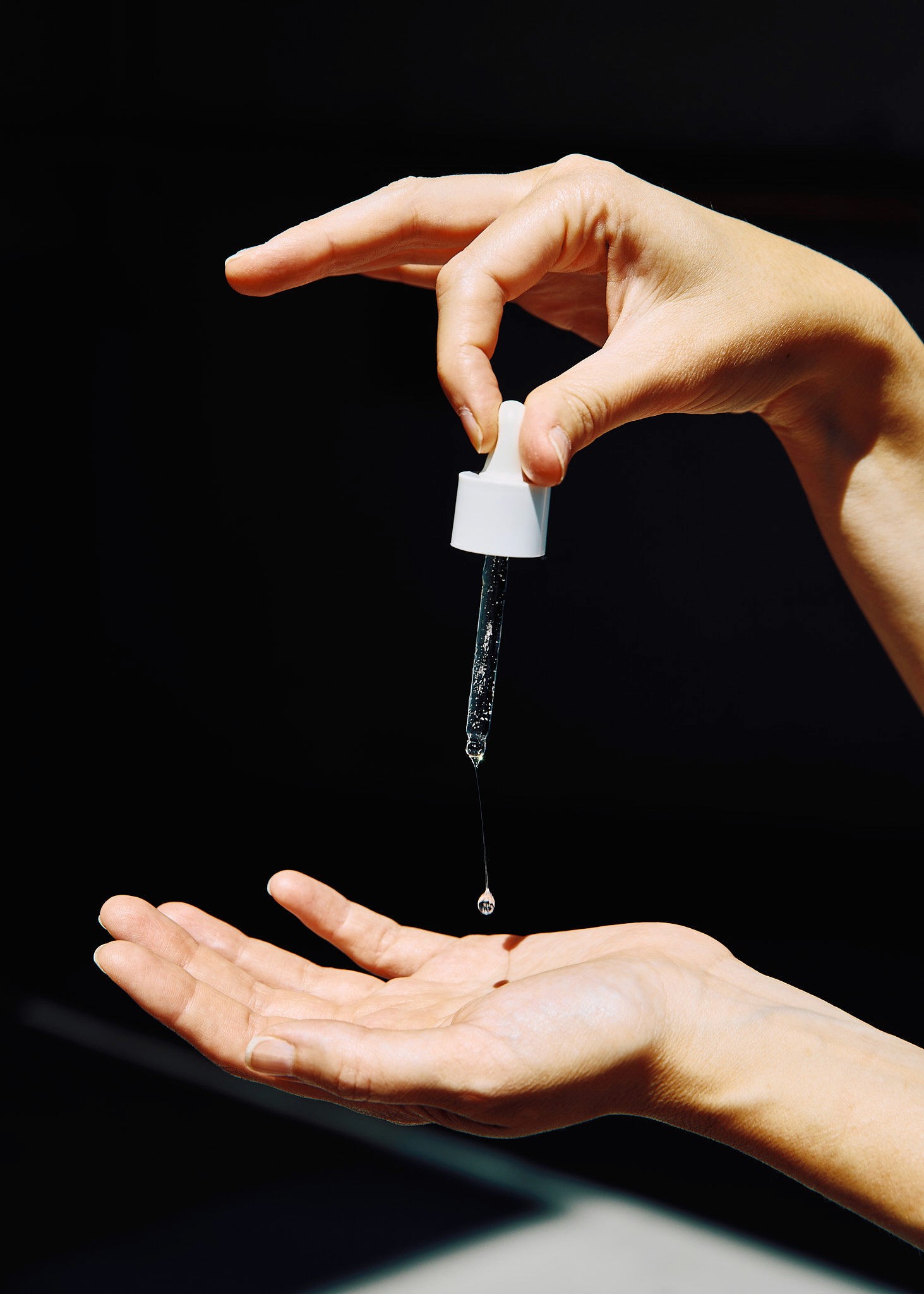 Woman with red hair covering mouth with hair