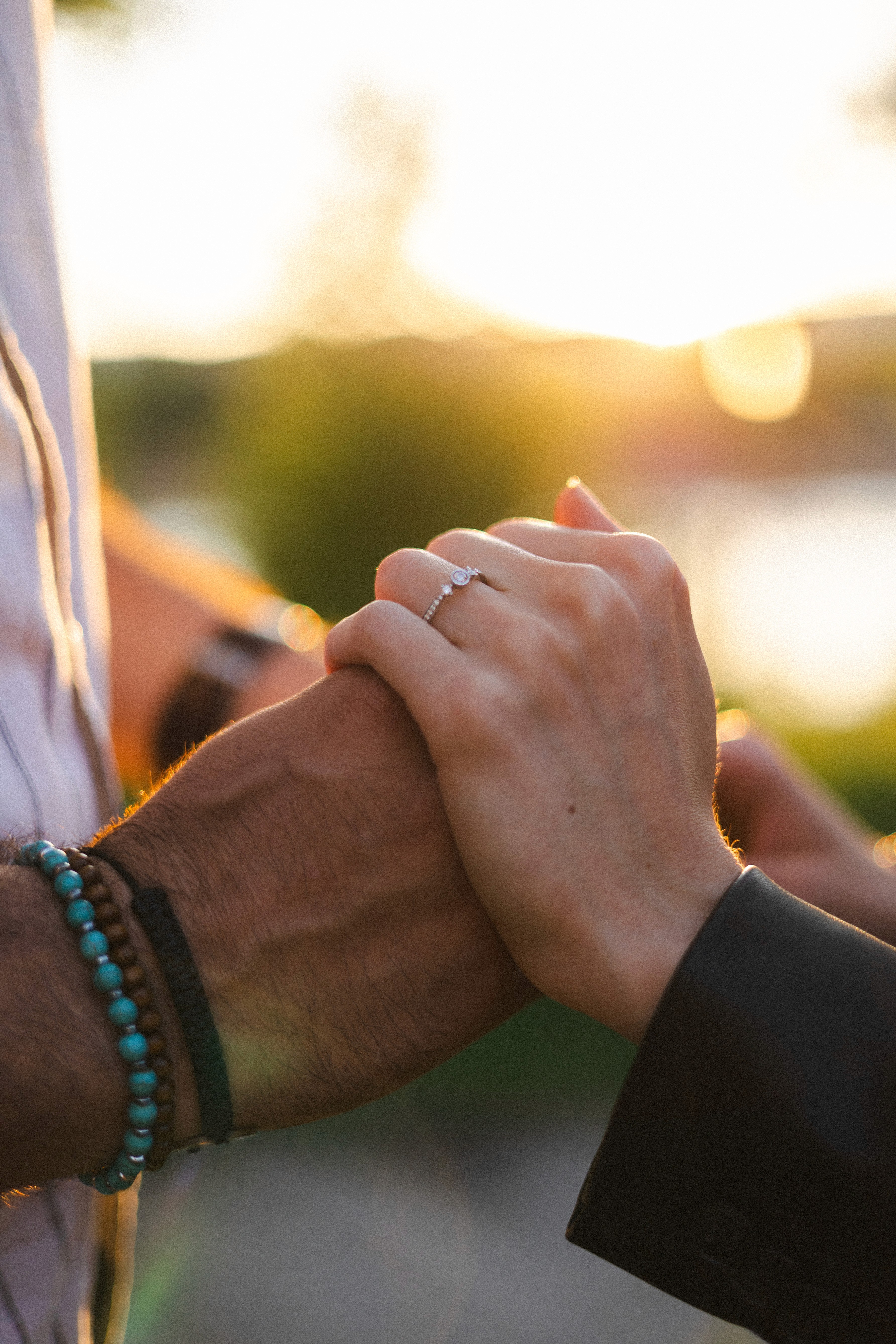 A cozy garden corner featuring potted herbs, a wooden bench, a watering can, and a wicker basket with towels, creating a serene and natural outdoor vibe.