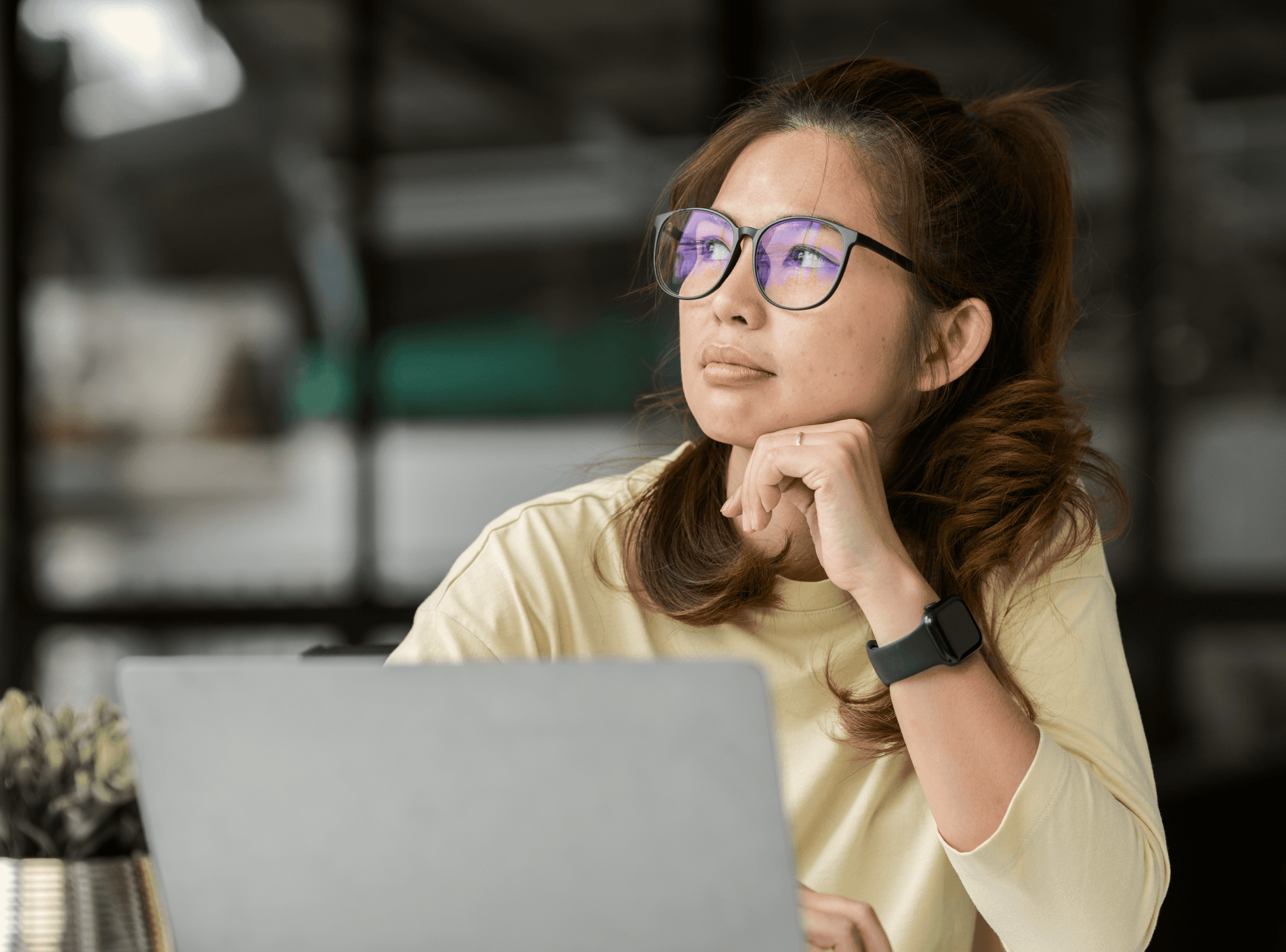 Filipina woman with laptop is in deep thought