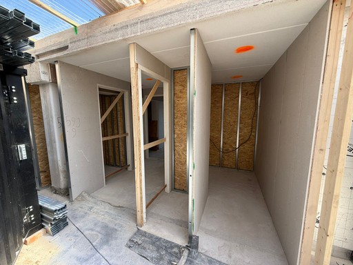 man in yellow shirt and blue denim jeans jumping on brown wooden railings under blue and