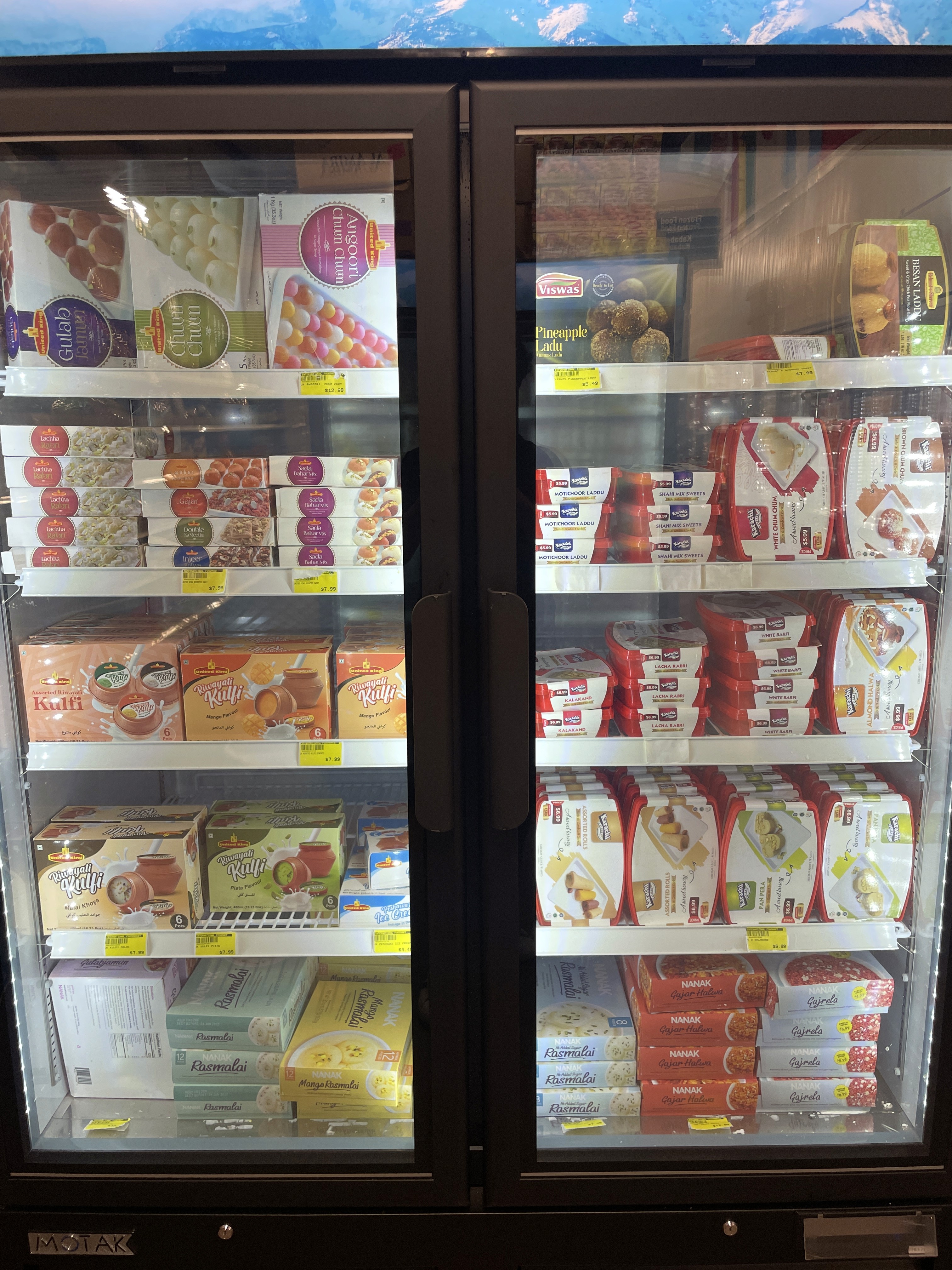 Selection of frozen foods including frozen parathas and pizzas at International Food Market Orlando