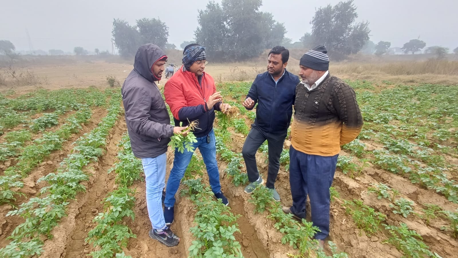 A man stading with Surfboard