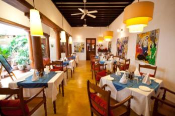 Tables in the restaurant area of Maison Perumal.