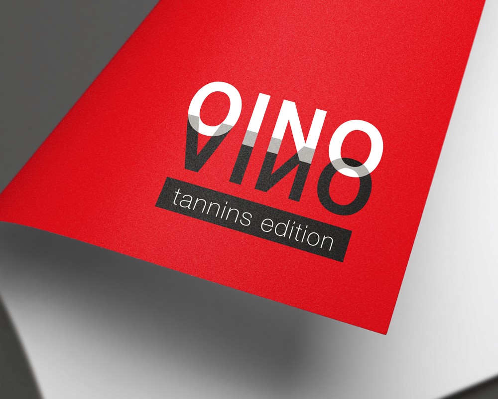 Close-up of the OINO VINO tannins edition visual identity on red printed material