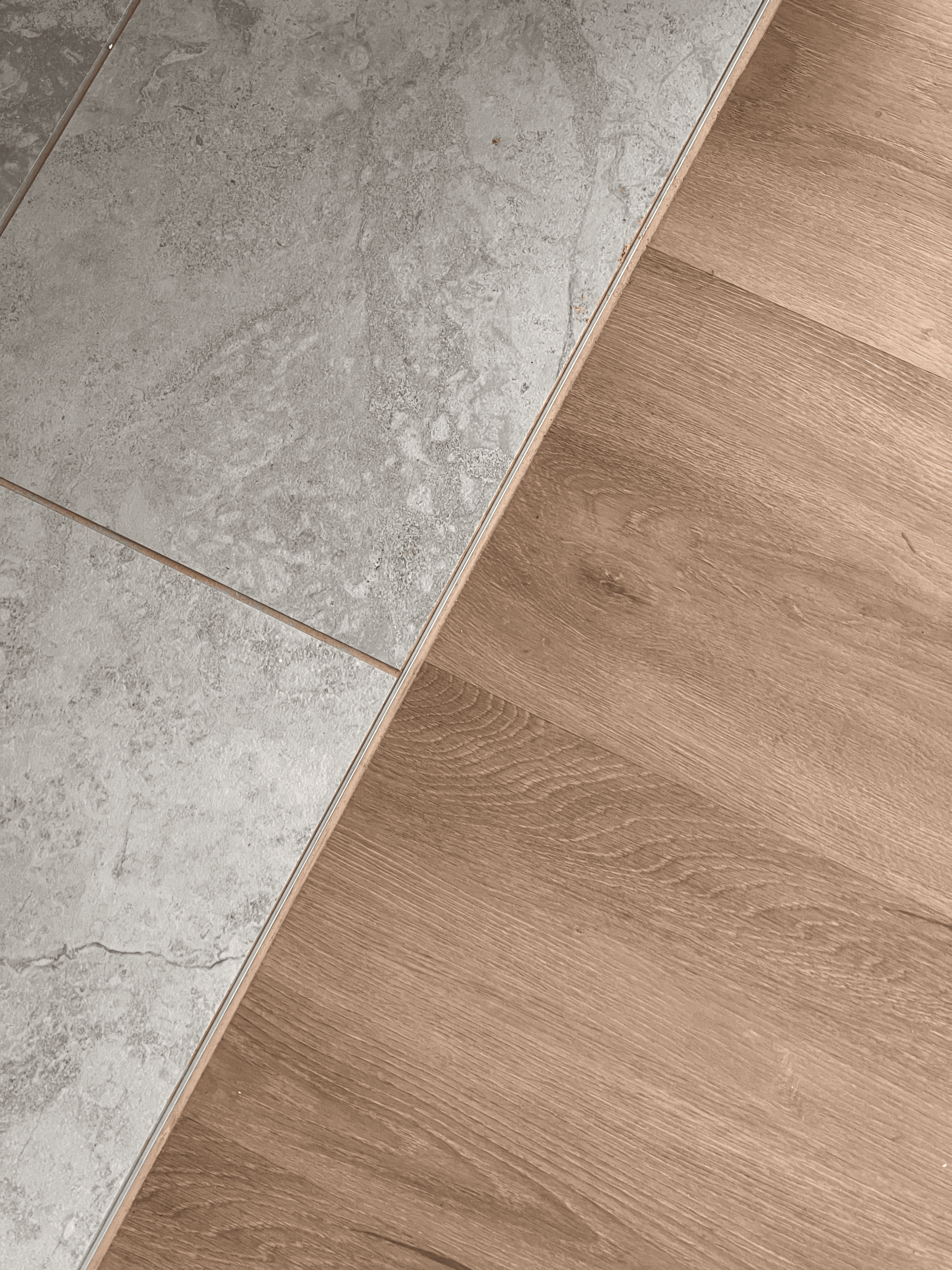 Seamless transition from tile to timber-look hybrid flooring in a Queensland home, designed for water resistance and everyday durability.