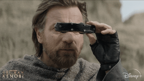 Gif représentant Obi Wan Kenobi dans la série Star Wars entrain de regarder au travers de jumelles.