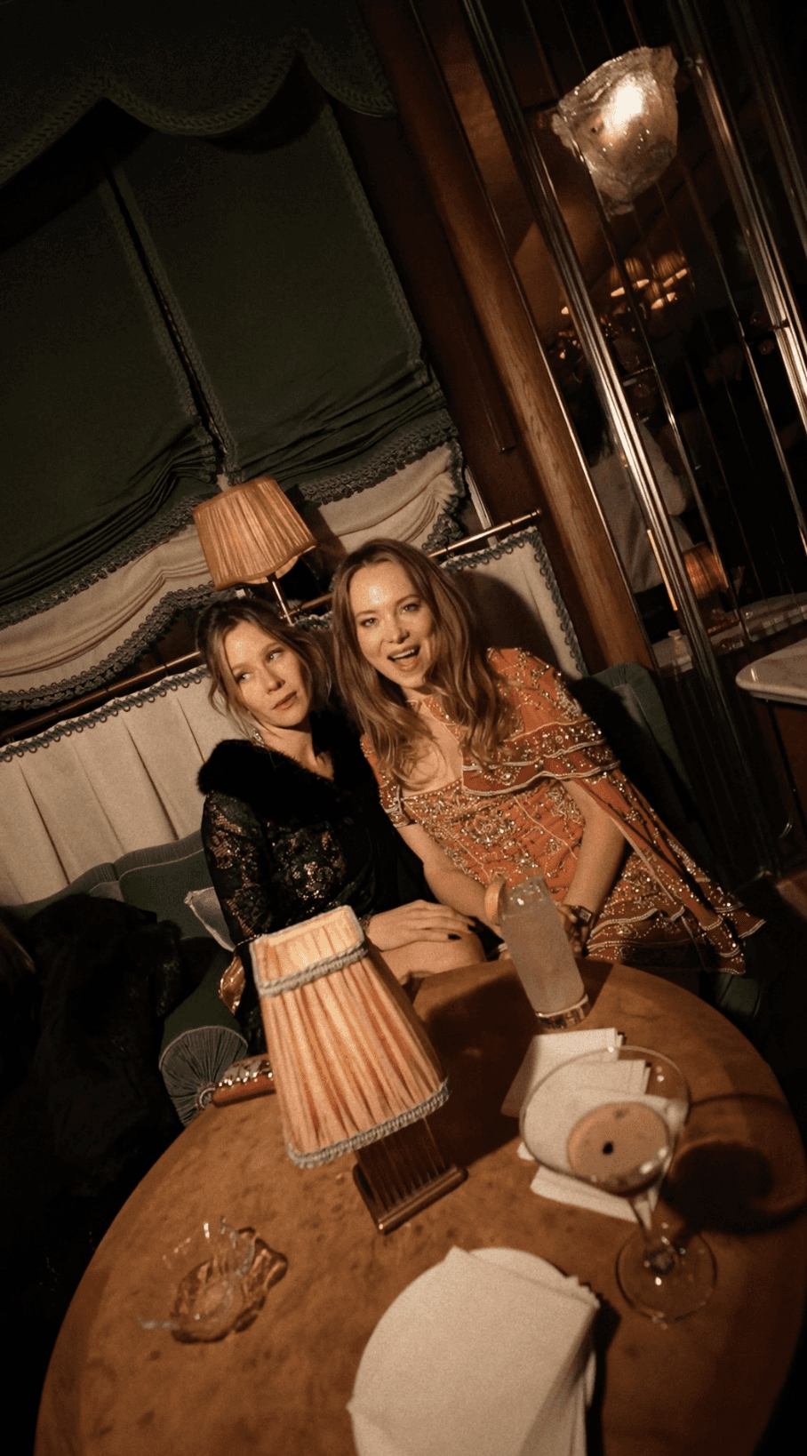 Bride in white dress walking on street, man in background