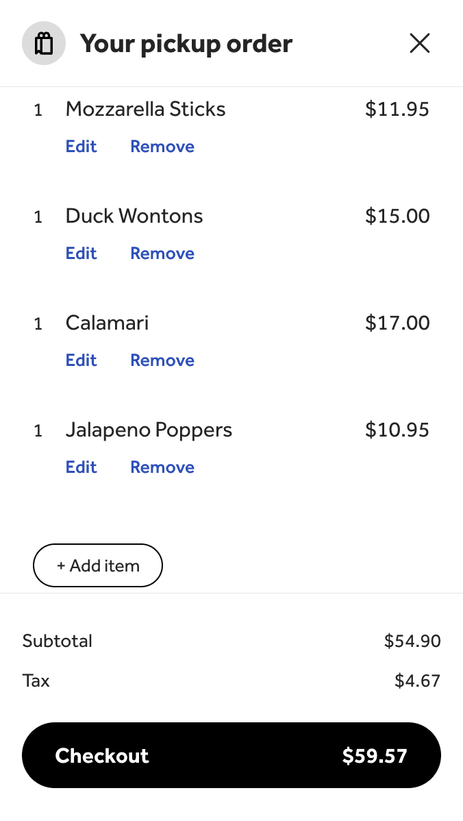 An elephant with large tusks in a lush green landscape.