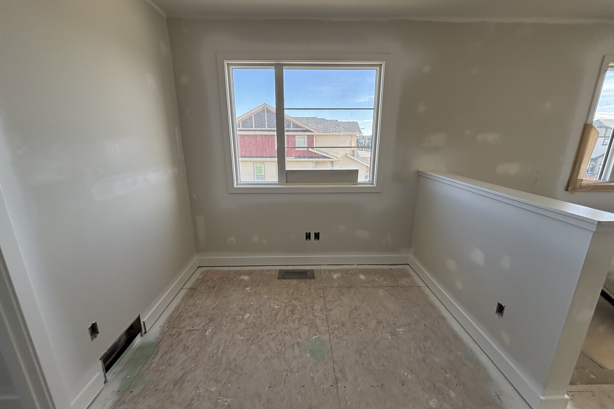 Heartland loft during construction: taped drywall and bare subfloor