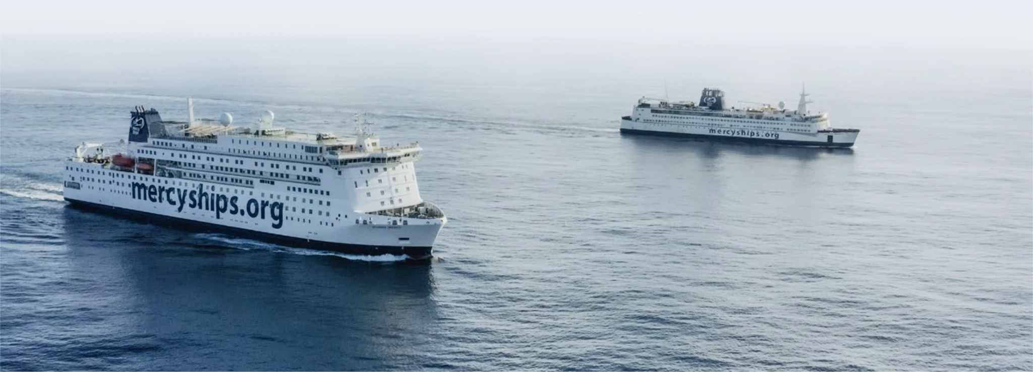 Two hospital boats floating across the ocean