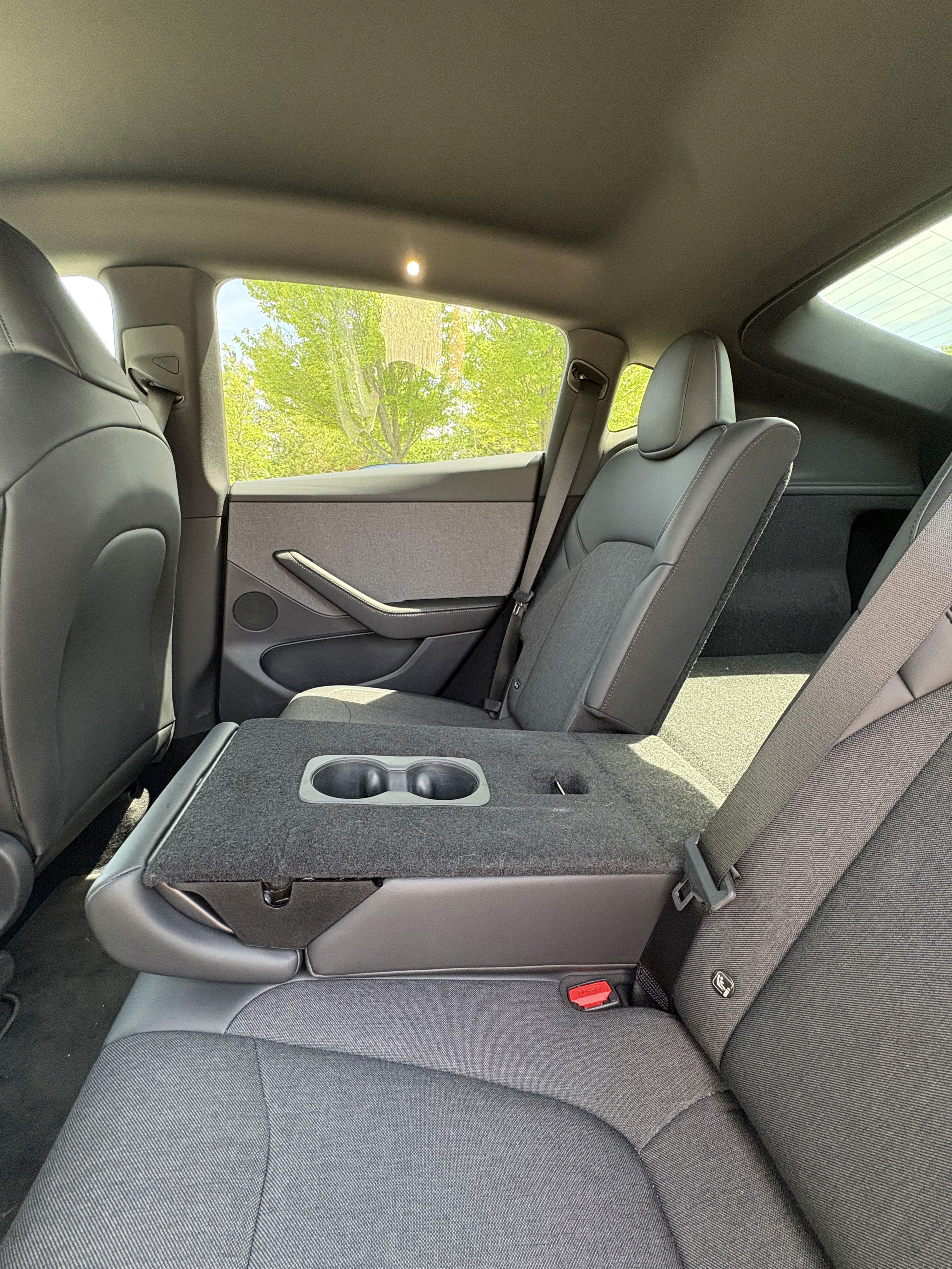 Tesla Entry Level Model Y Rear Seats with middle seat folded down